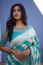 Load image into Gallery viewer, Kala Niketan Mesmeric Turquoise Soft Banarasi Silk Saree With Blissful Turquoise Blouse Piece
